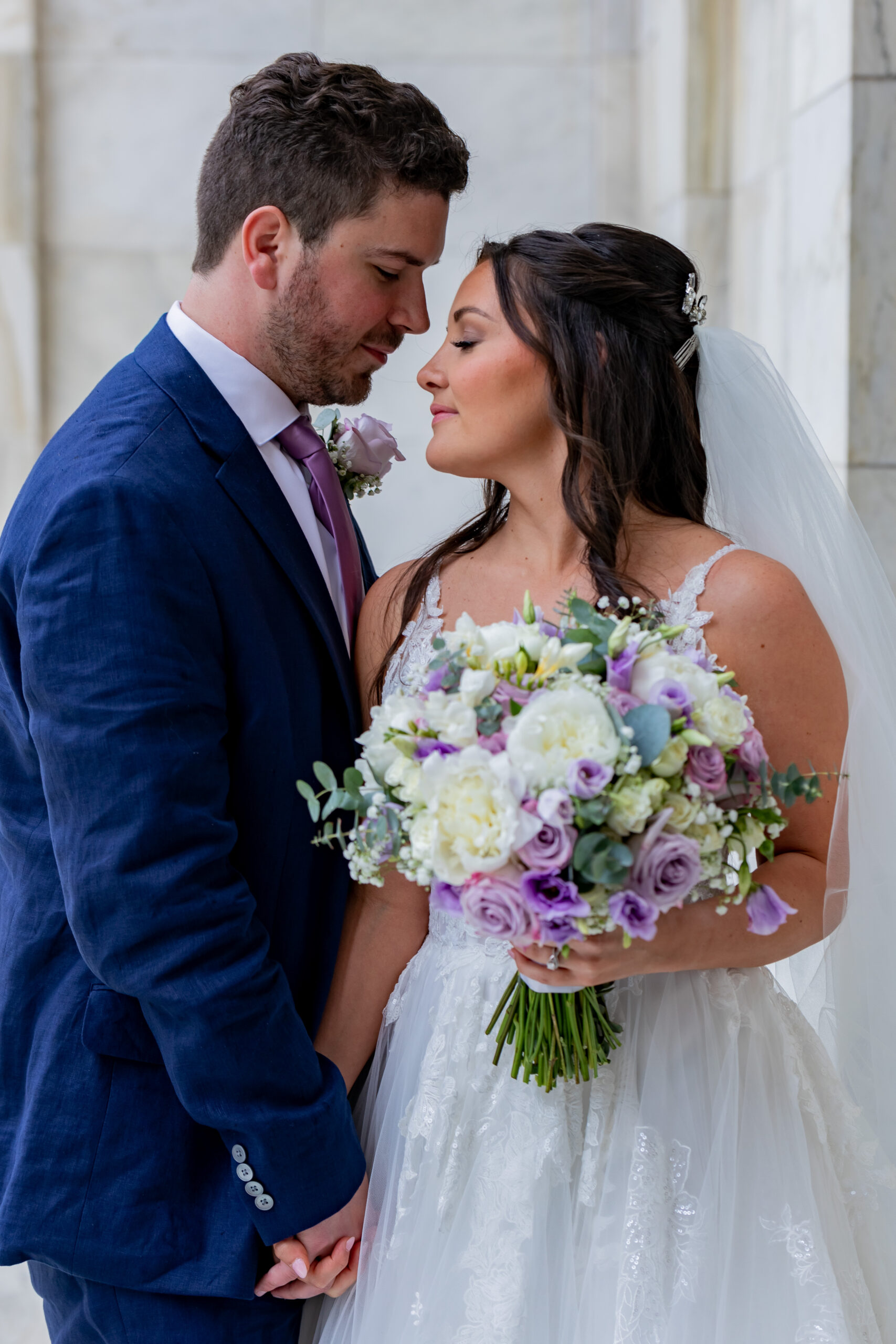 bride and groom look at each other lovingly