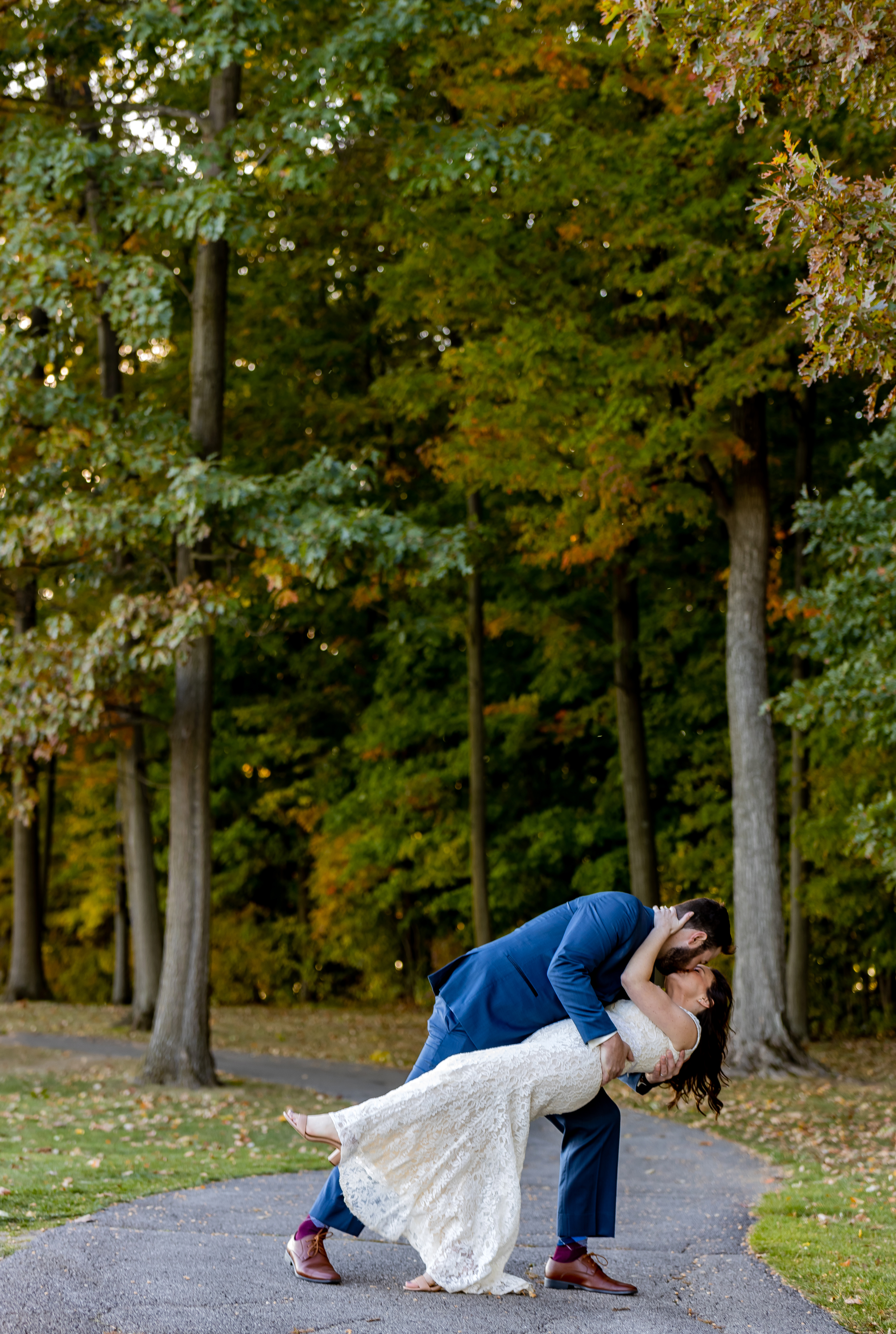 groom dipping and kissing bride