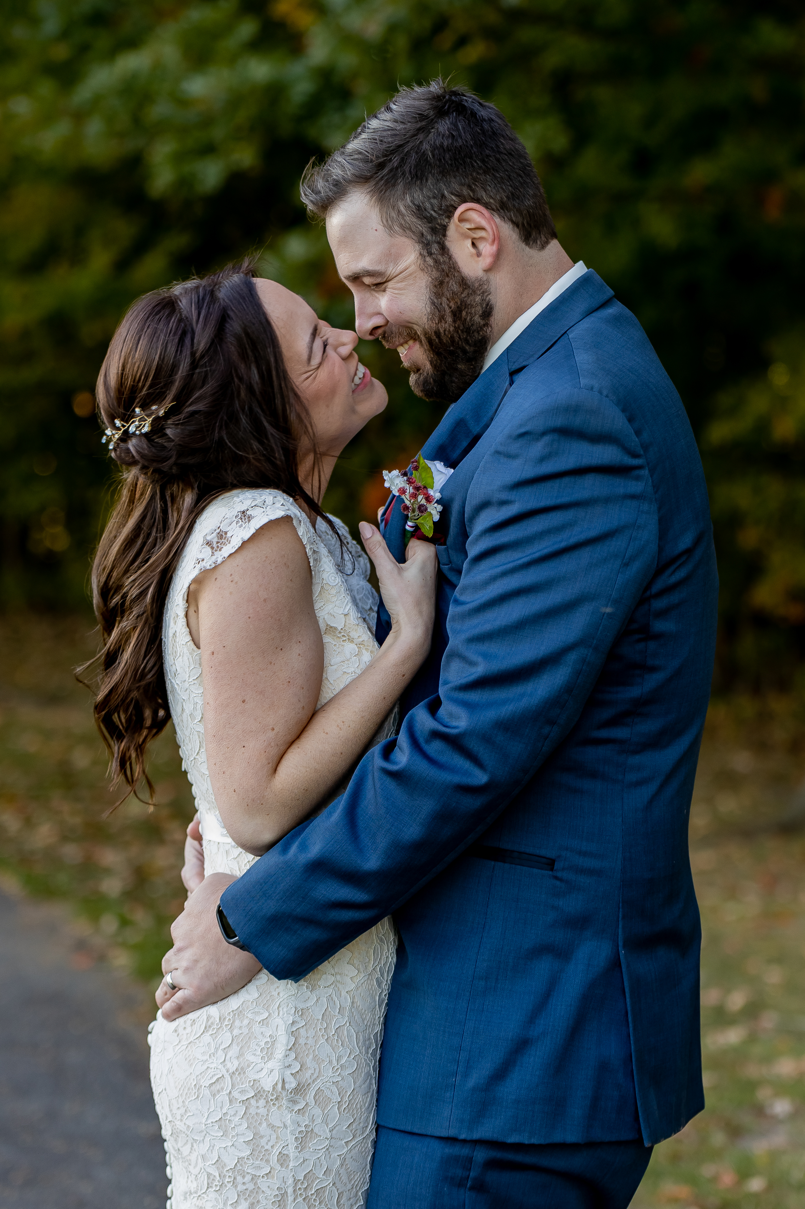 bride and groom hugging and smiling