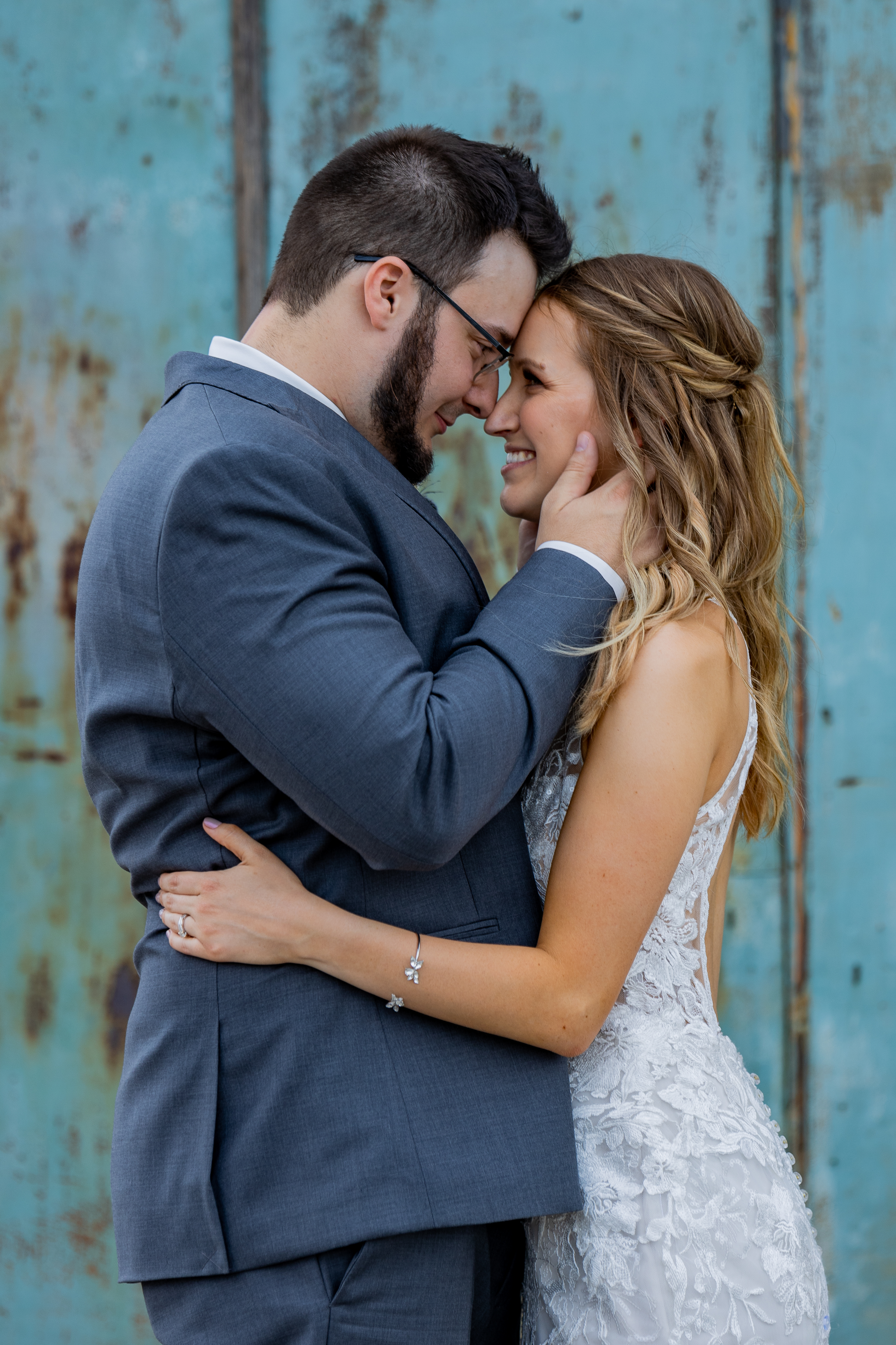 bride and groom hugging