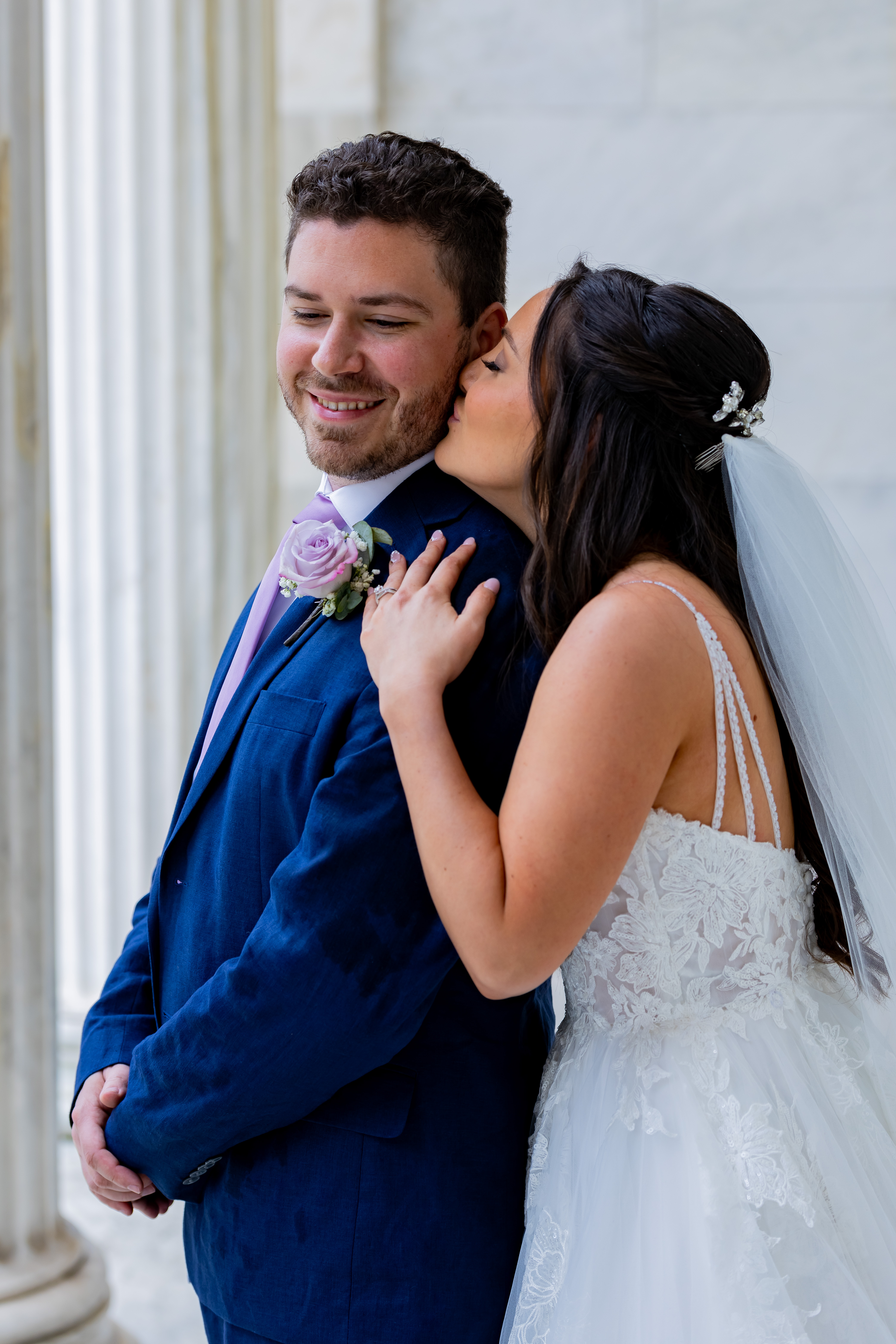 bride kissing groom on forehead
