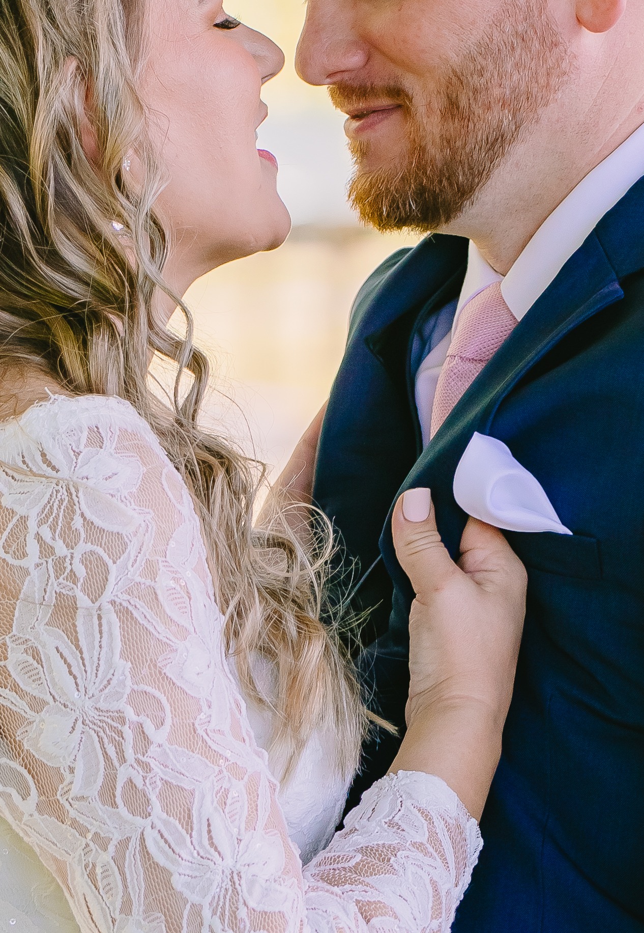 bride and groom about to kiss