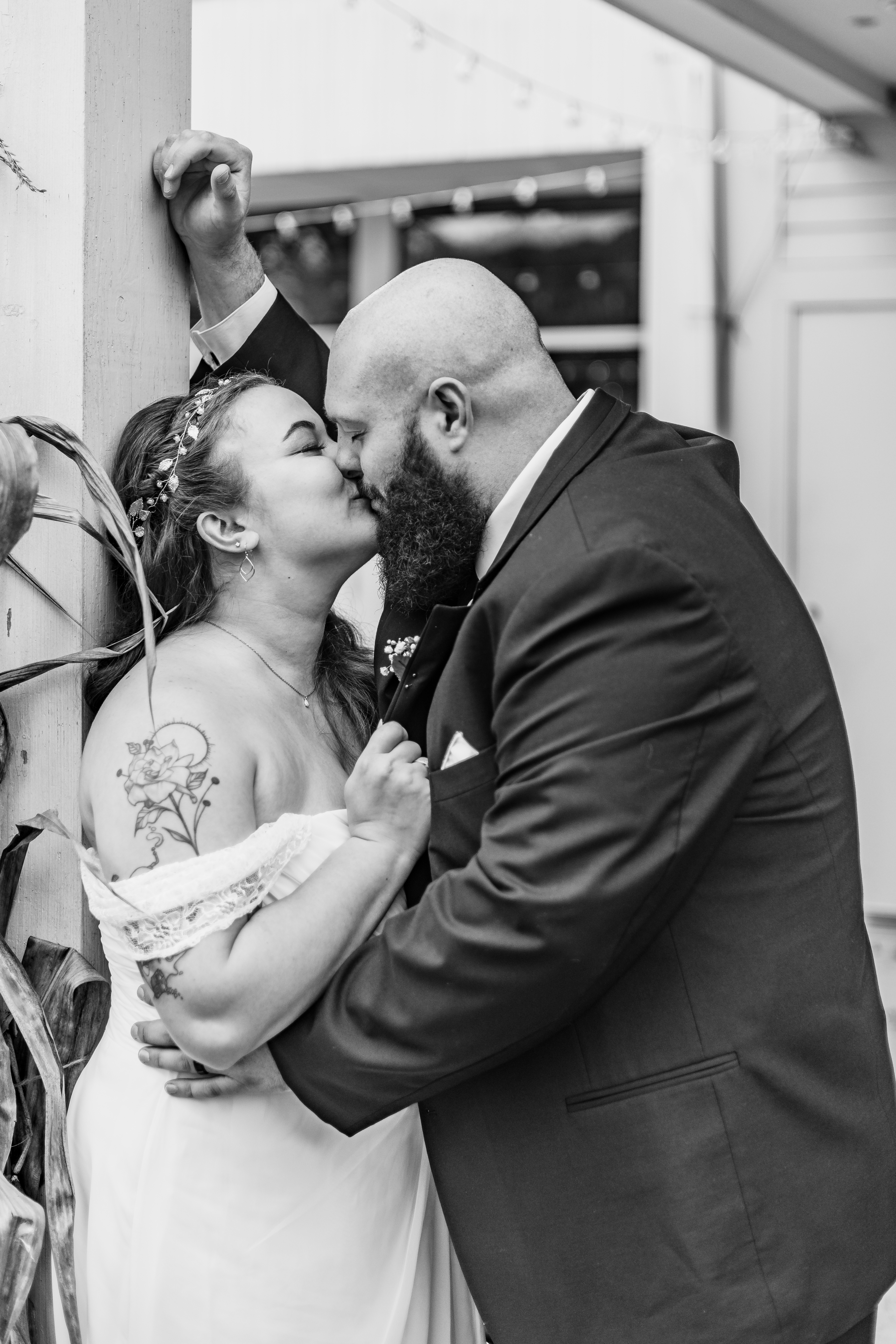 black and white wedding portrait of couple kissing