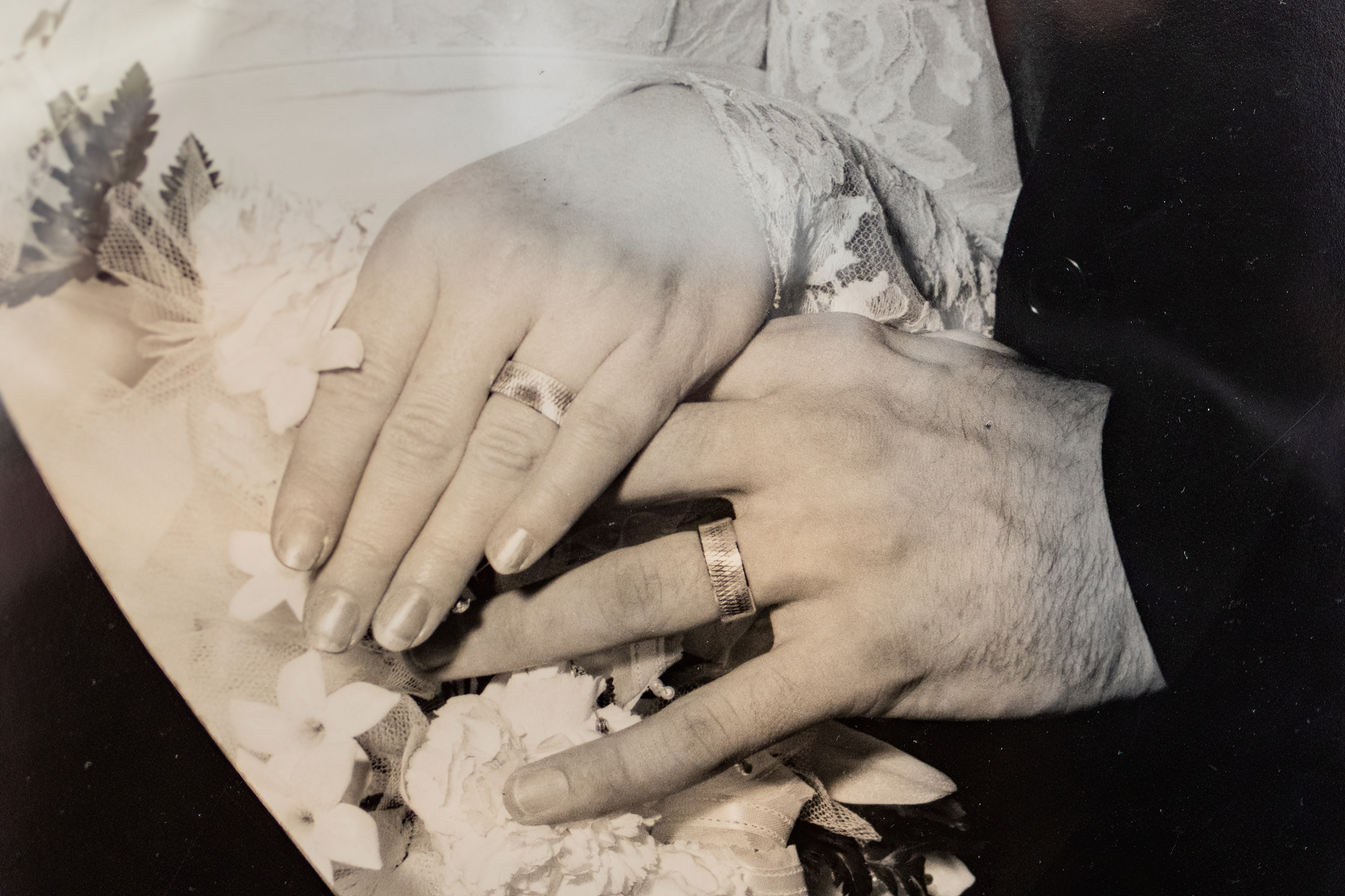 black and white portrait bride and groom's rings