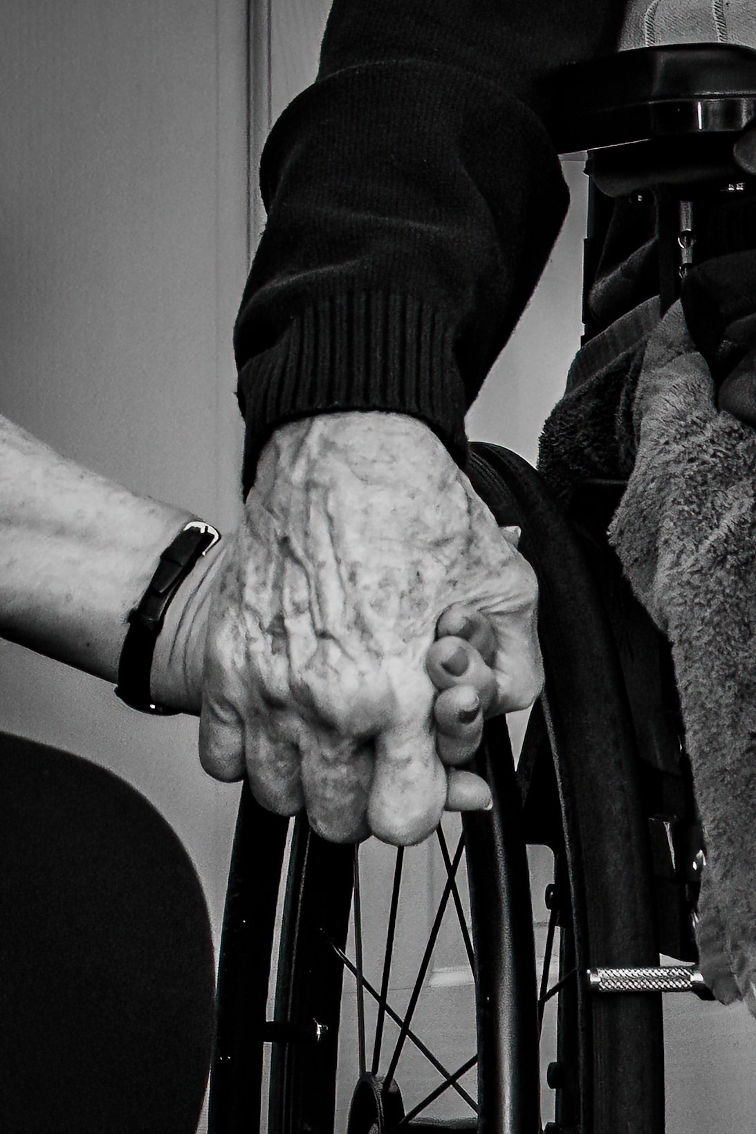 black and white portrait elderly couple holding hands
