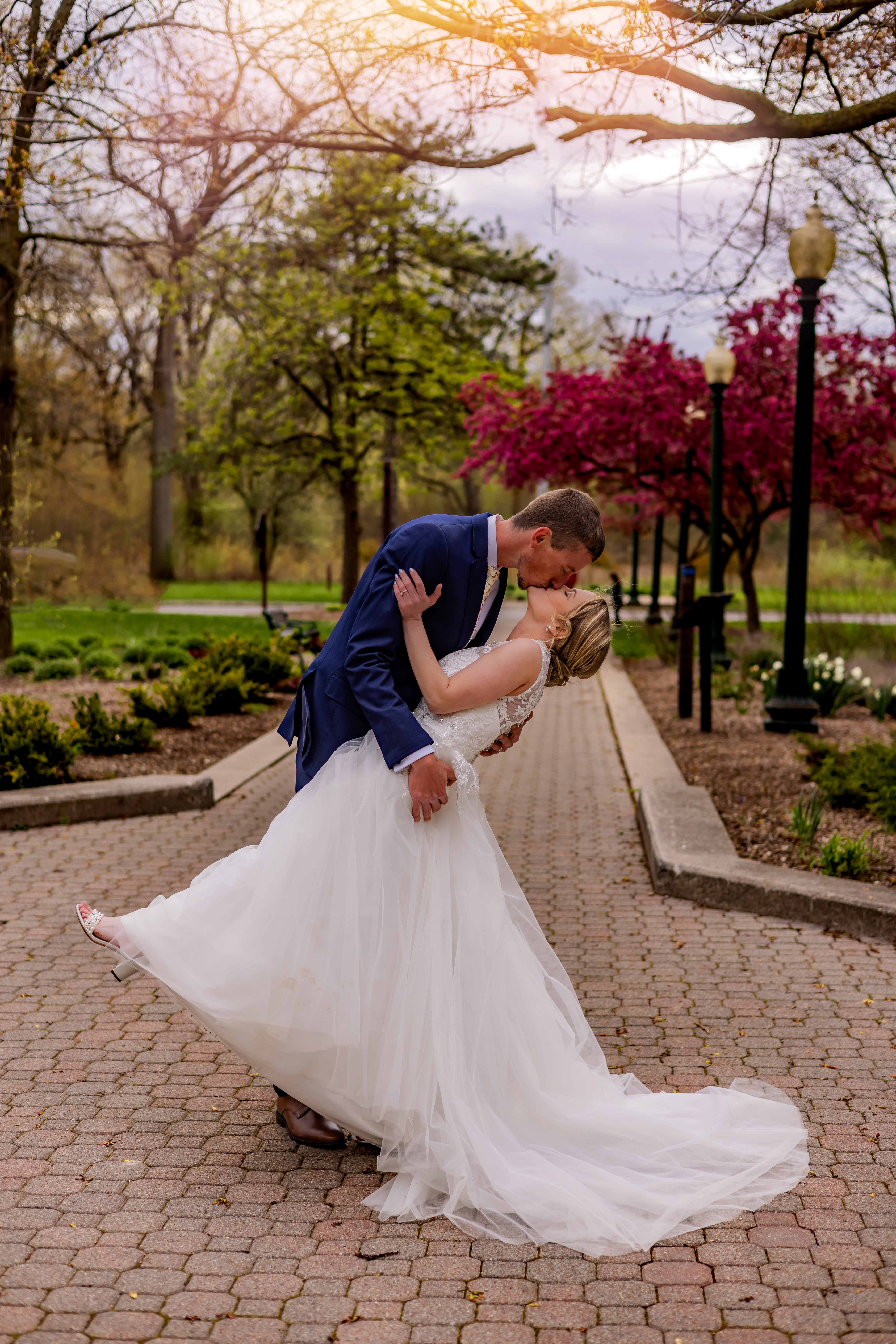 groom dipping and kissing bride