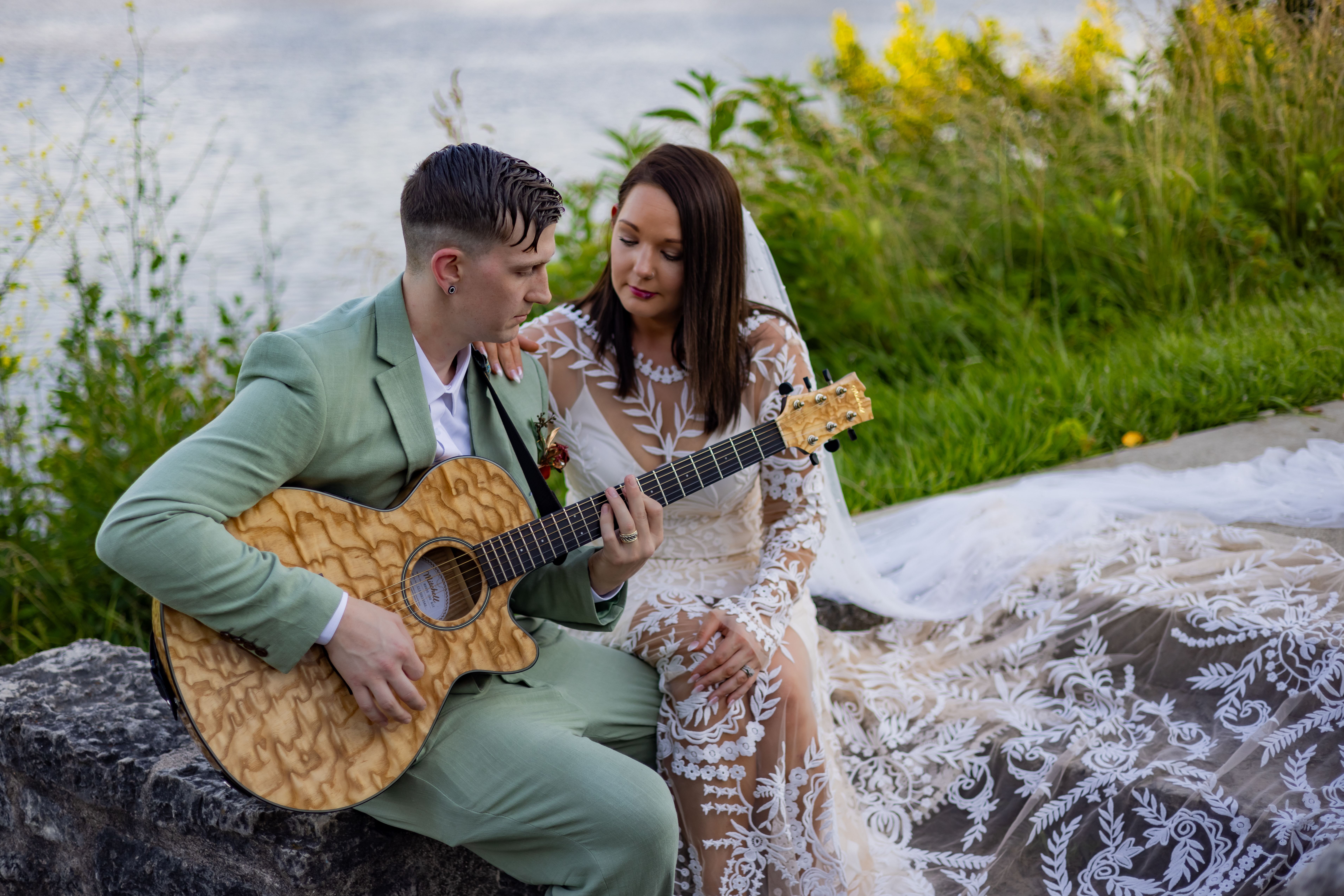 groom playing guitar for bride