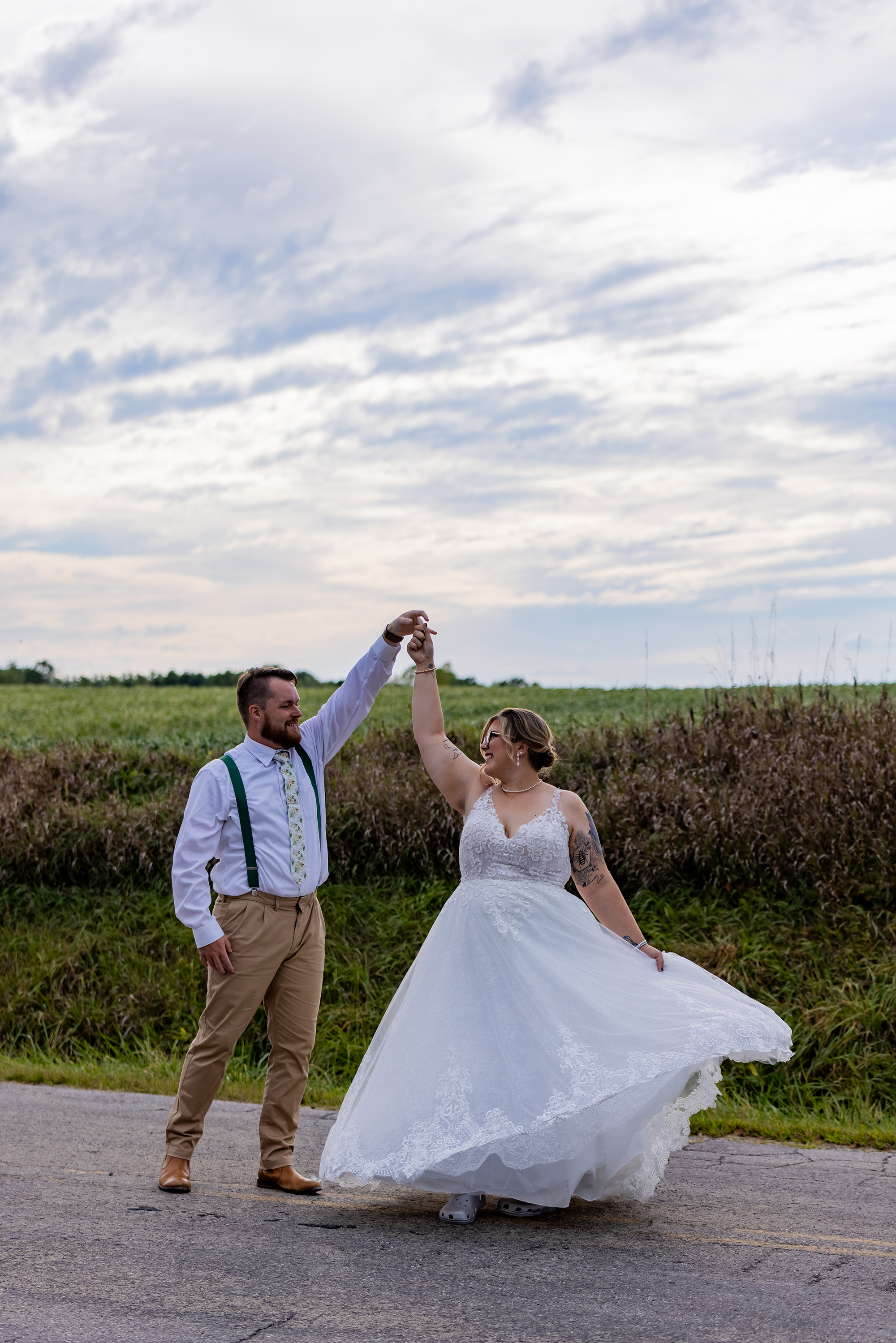 groom twirling bride