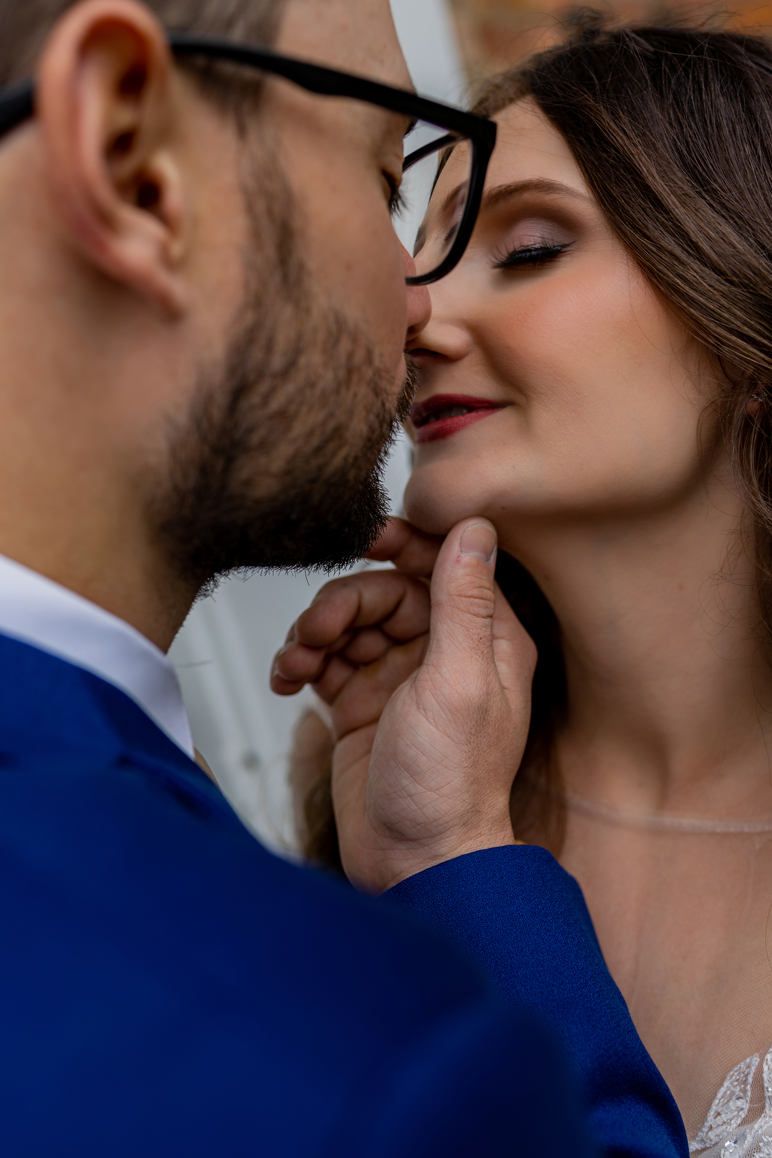 bride and groom about to kiss