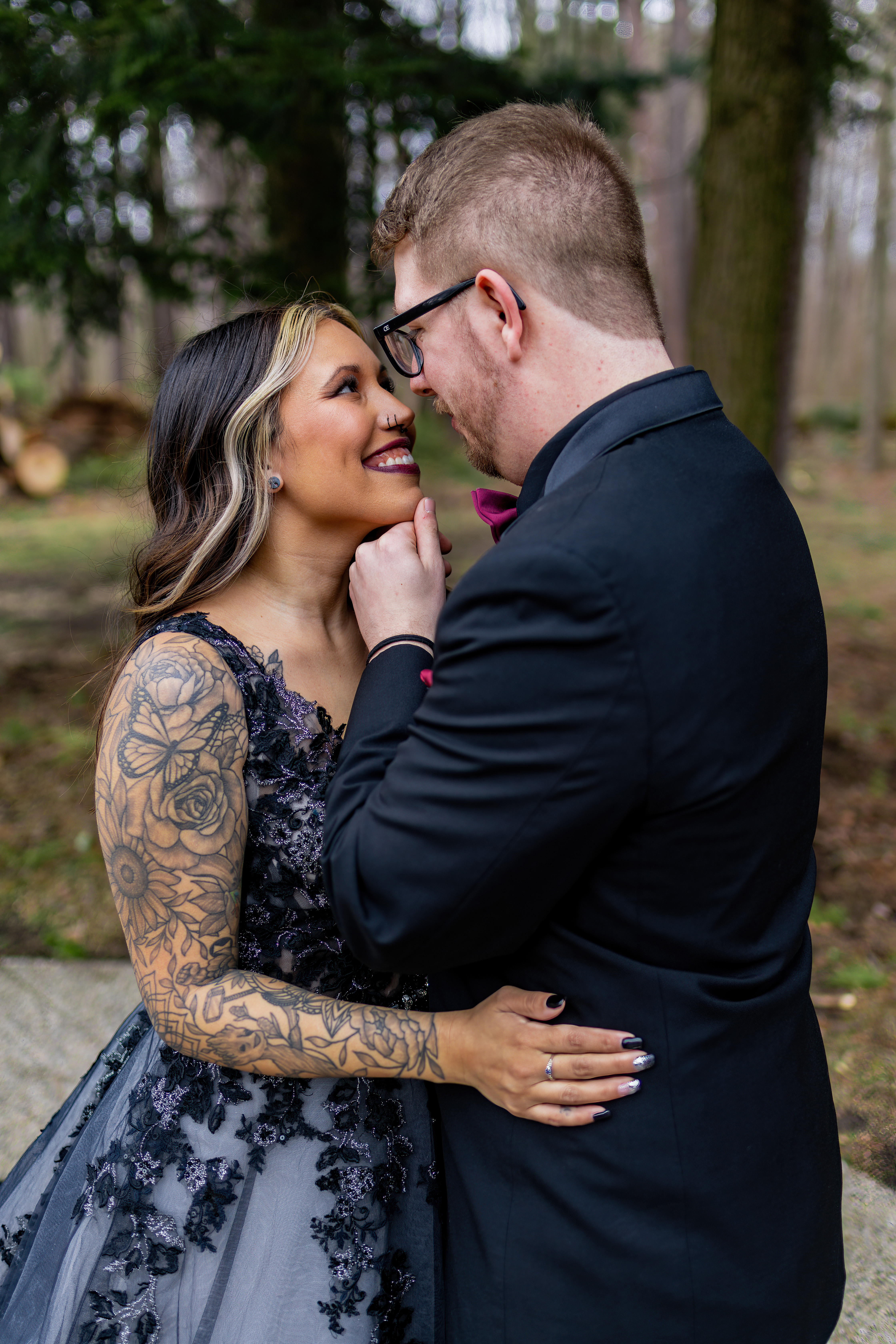 bride and groom smiling and embracing