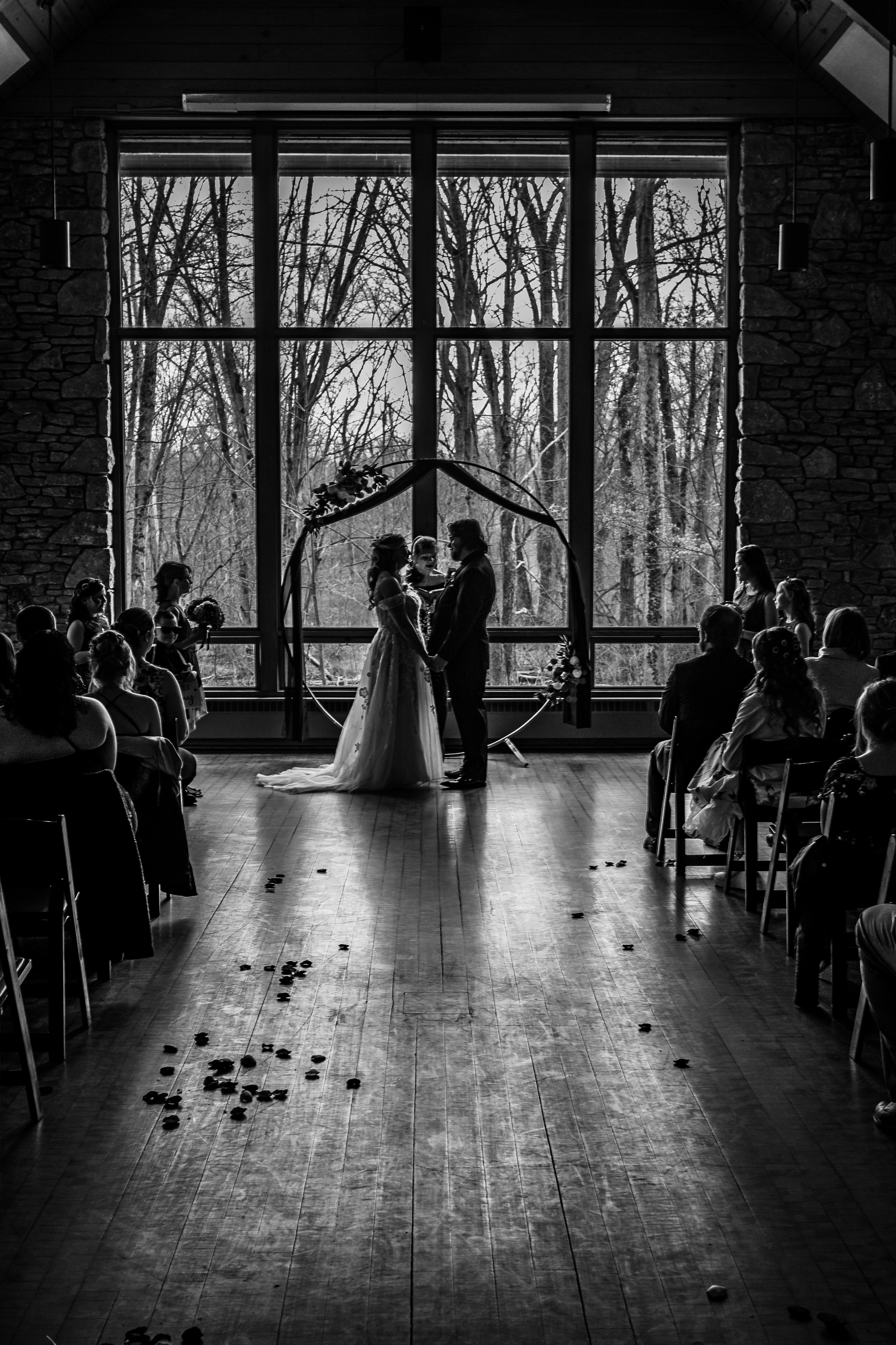 black and white portrait of indoor wedding ceremony
