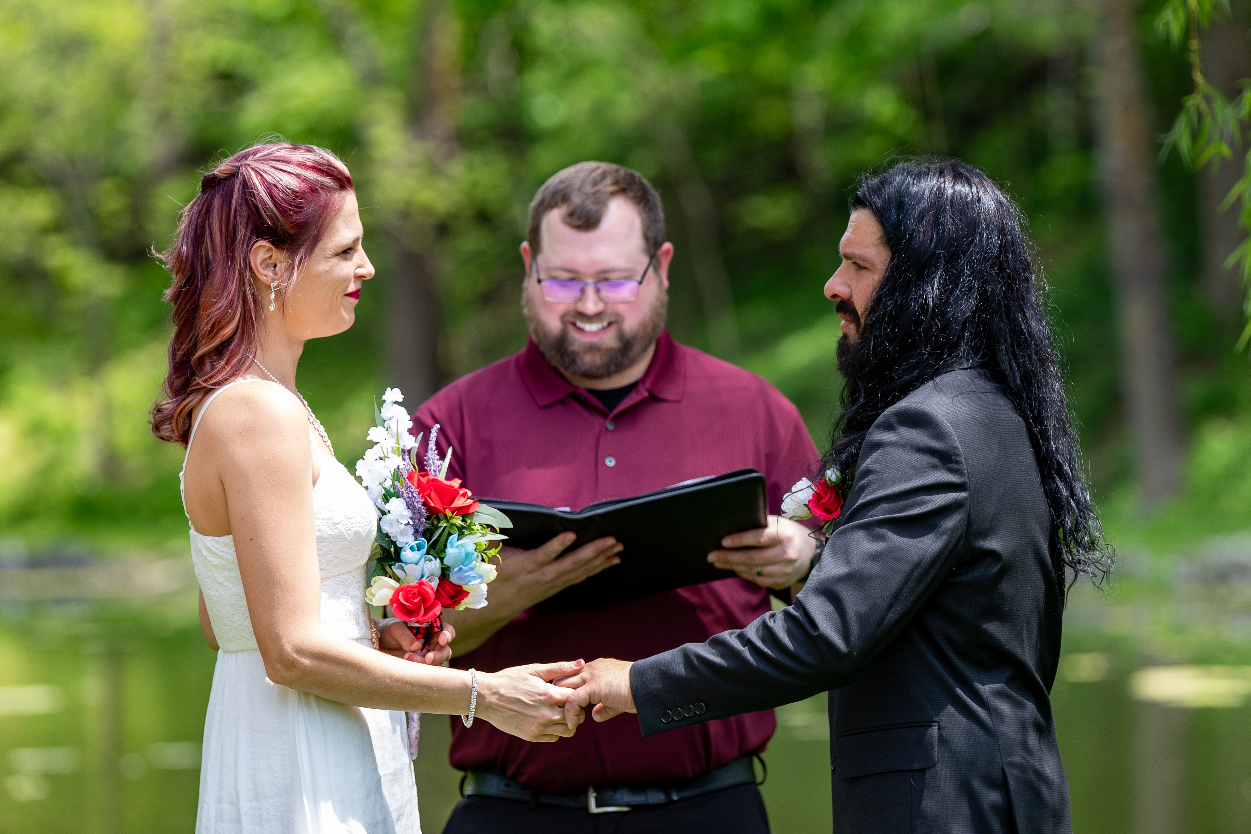 couple saying vows in outdoor wedding ceremony