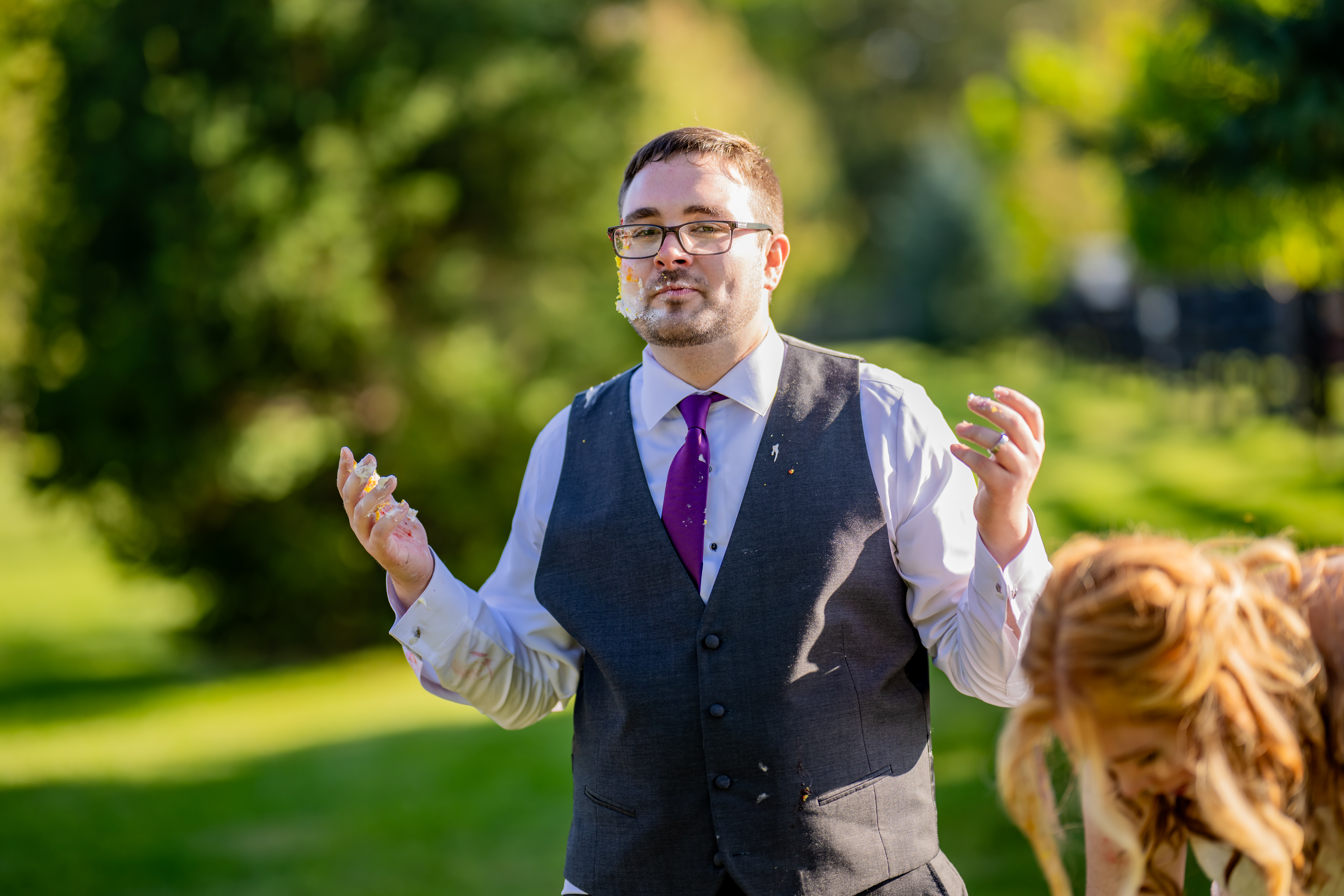 groom with cake on face